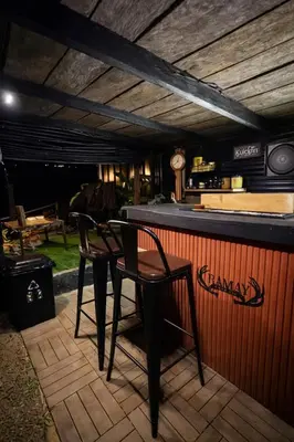 two chairs sitting at a bar in a restaurant at Gamay Payag Tagaytay in Calamba