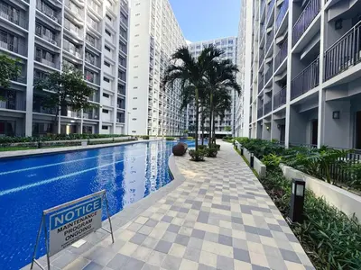 a swimming pool in the middle of a building at City View Shore2 Residence Tower1 in Manila