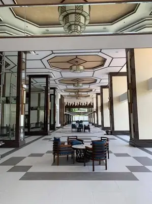 a hallway with chairs and tables in a building at Villa Felize Homestay at Torre de Manila in Manila