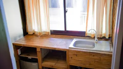 a kitchen with a sink and a window at Cool Martin Family Hotel and Resort in Bacoor