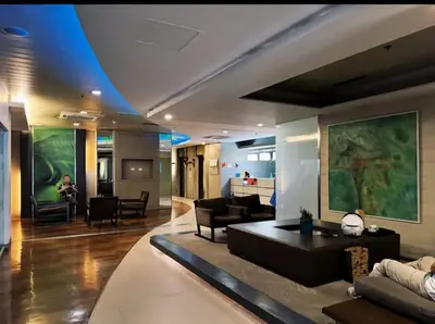 a living room with a couch and a table at Luxury 2BR Condo in Makati Near Malls & Offices in Manila