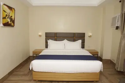 a bedroom with a large bed in a room at Sun Star Grand Hotel in Manila