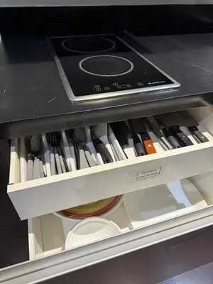 a drawer filled with lots of cooking utensils at The Gramercy Residences in Manila