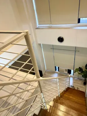 a spiral staircase in a room with a ceiling at The Gramercy Residences in Manila