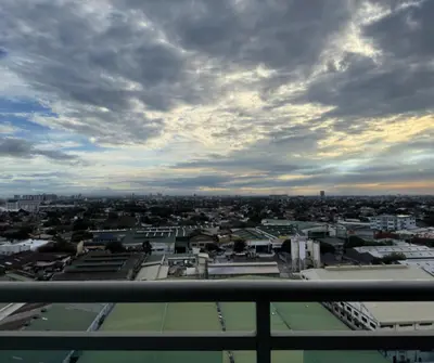 a view of a city under a cloudy sky at Azure Residences Staycation in Manila