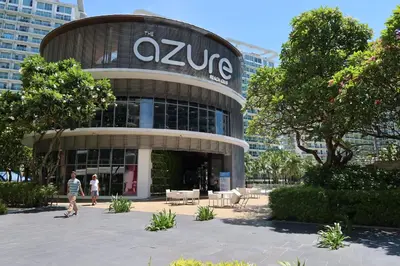 a large building with people walking in front of it at Azure Residences Staycation in Manila