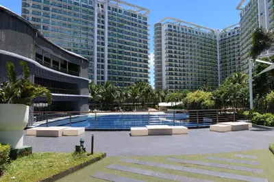 a pool in front of some tall buildings at Azure Residences Staycation in Manila