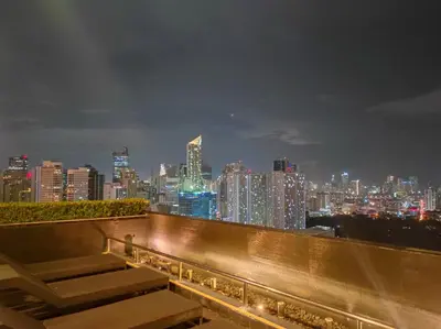 a view of a city skyline at night at Stay in Makati 1-BR Condo with Pool, Fast WiFi, Gym, Balcony in Manila