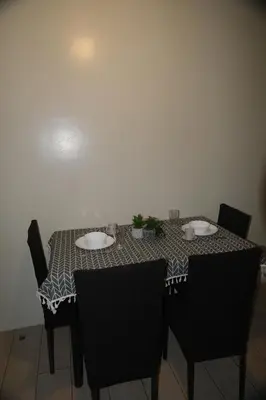 a table with two plates on top of it at Cluster 3, 81 Newport Blvd near NAIA T3 in Manila