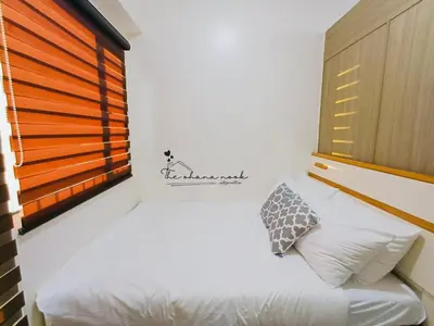 a small bedroom with a bed and a window at The Ohana Nook in Manila