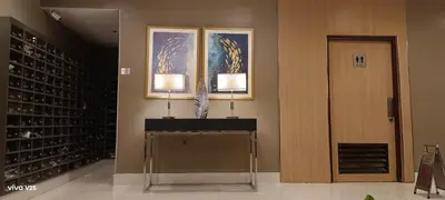 a wine cellar with two lamps and a window at Sea residences Sweetest escape in Manila