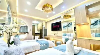 a hotel room with two beds and a tv at SM MOA Near NAIA Airports The B's Crib MOA in Manila