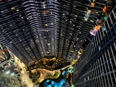 an overhead view of a large building at night at Pine3s Turf in Manila