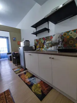 a kitchen with a sink and a counter top at SMDC Grace Residences Tower 4 in Manila