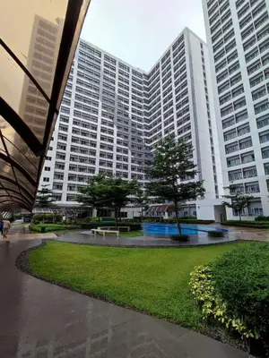 a large building with a park in front of it at SMDC Grace Residences Tower 4 in Manila