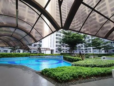 an overhead view of a swimming pool in a building at SMDC Grace Residences Tower 4 in Manila