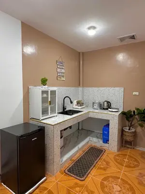 a small kitchen with a counter and a sink at PPL Homestay