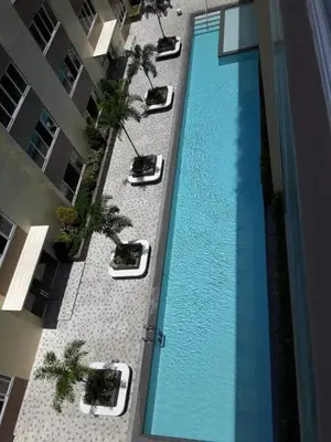 an overhead view of a swimming pool in a building at The Cozy Place in Silang