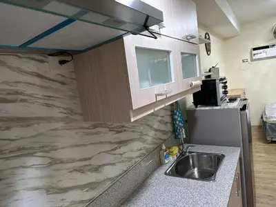 a kitchen with a sink and a counter top at The Cozy Place in Silang