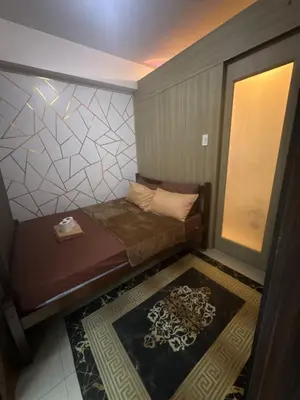 a small room with a bed and a window at Chen Staycation at Shore in Manila