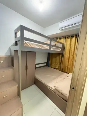 a bunk bed room with two bunk beds in it at Vera's Place in Mall of Asia Complex in Manila