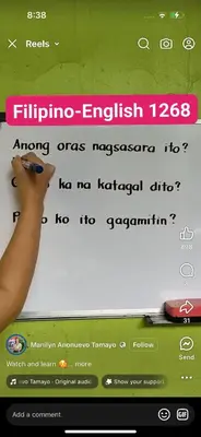 a computer screen with a persons hand pointing at a website at Lornas Place in Manila