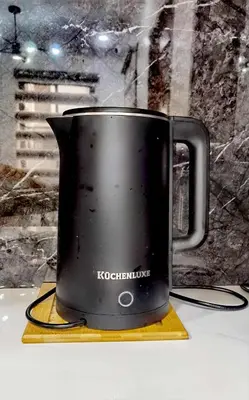 a black coffee pot sitting on a yellow towel at Modern 3BR Cozy Homestay Antipolo in Antipolo