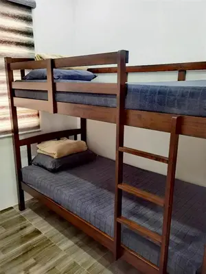 a couple of bunk beds in a room at Modern 3BR Cozy Homestay Antipolo in Antipolo