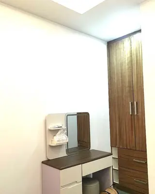 a bathroom with a mirror and a dressing table at Modern 3BR Cozy Homestay Antipolo in Antipolo