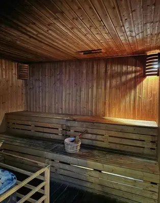 a wooden sauna with a wooden bowl and a wooden spoon at Cozy Studio Unit at The Knightsbridge Residences in Manila