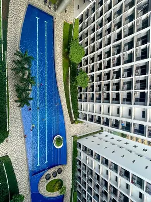 an overhead view of a building with a blue pool at E&C Rentals in Manila