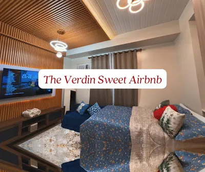 a bedroom with a bed and a tv at The Verdin Sweet at Maple Grove Gen Tri Cavite in General Trias