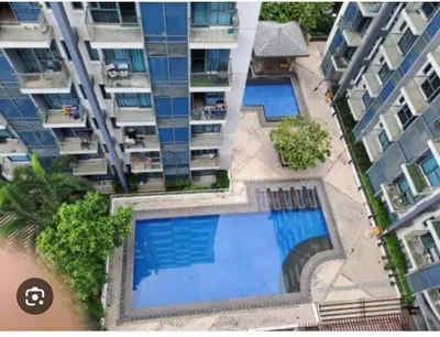an overhead view of two swimming pools in a building at Vevilyn Nariz in Manila