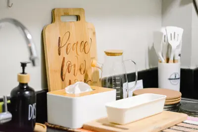 a kitchen counter with a cutting board with the words leave food at The Soft Stay 1BR SM Jazz Makati in Manila