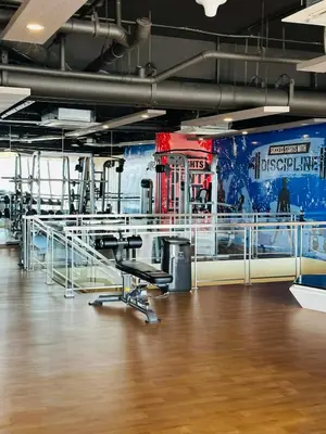 a gym with desks and chairs in a room at Functional and Convenient stay in Eastwood City in Manila