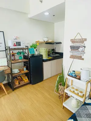 a kitchen with a counter and a counter top at Casa Verde Suite - Staycation
