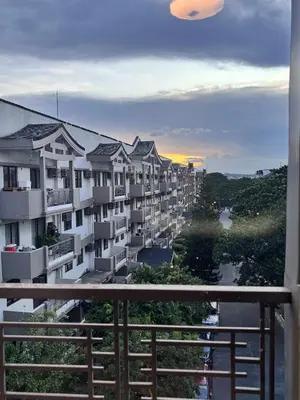 a view from the balcony of a apartment building at Modern 2BR Condo in Acacia Estate, Quiet & Green in Manila
