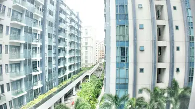a view of two tall buildings in a city at Spacious Family Room Near NAIA Airport in Manila
