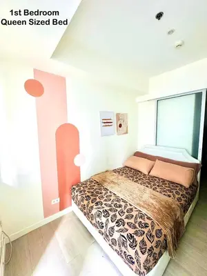 a bedroom with a bed in a room at Deluxe penthouse unit at azure - near airport in Manila