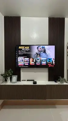 a flat screen tv hanging on a wall at Condotel 1BR w balcony at MOA SMDC Shore3 T1 in Manila