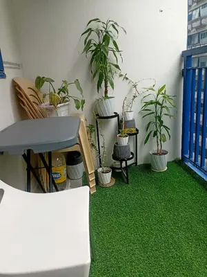 a room with potted plants on the floor at Condotel Sea Residence's Place Near Moa in Manila