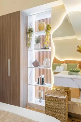a room with a desk and a shelf with books at Cozy Modern Organic 1BR with Washer and WiFi Near BGC in Manila
