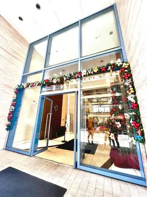 a store front with christmas decorations on it at Luxurious Homey Suite IN FRONT of US Embassy Manila Bay in Manila