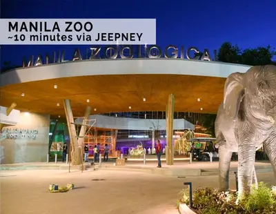 a statue of an elephant in front of a building at Luxurious Homey Suite IN FRONT of US Embassy Manila Bay in Manila
