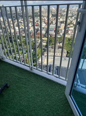 a balcony with a view of a city at Jazz Residences Condominium in Manila