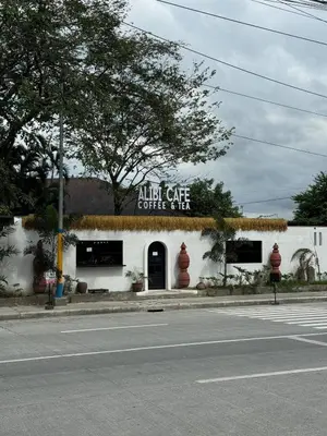 an alligator cafe is on the side of a street at Alea Residences 1 Bedroom Condo with Pool View Balcony in Manila