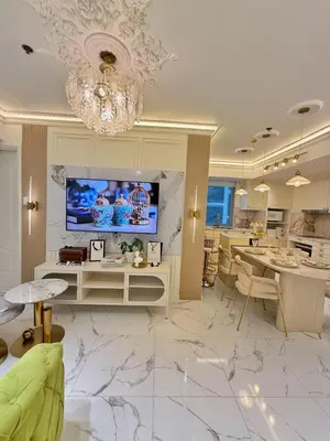 a living room with a chandelier and a dining room at Azure 2BR Beach View Suite- Bathtub, Smart Toilet, Netflix in Manila