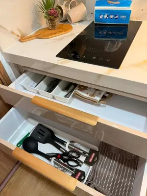 a drawer filled with lots of tools in a kitchen at Hotel-like flat at Bay City Haven Mall of Asia SMX in Manila