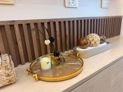 a glass table with a candle and a glass plate with a candle at Hotel-like flat at Bay City Haven Mall of Asia SMX in Manila