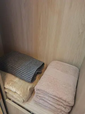 a small room with two pillows on a shelf at Hotel-like flat at Bay City Haven Mall of Asia SMX in Manila